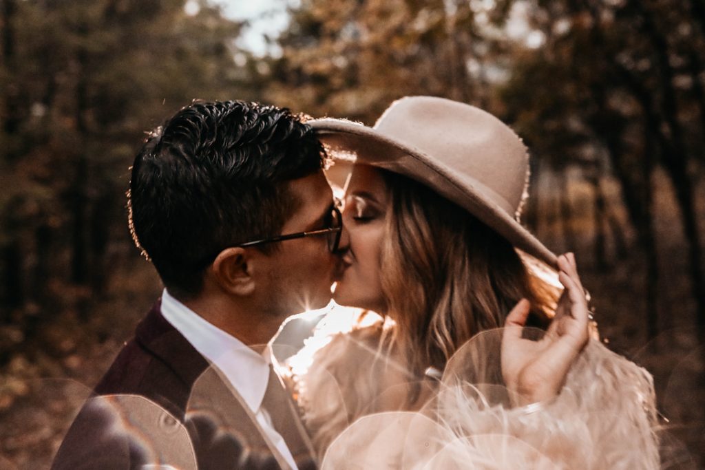 Glam Bride kisses her boho groom