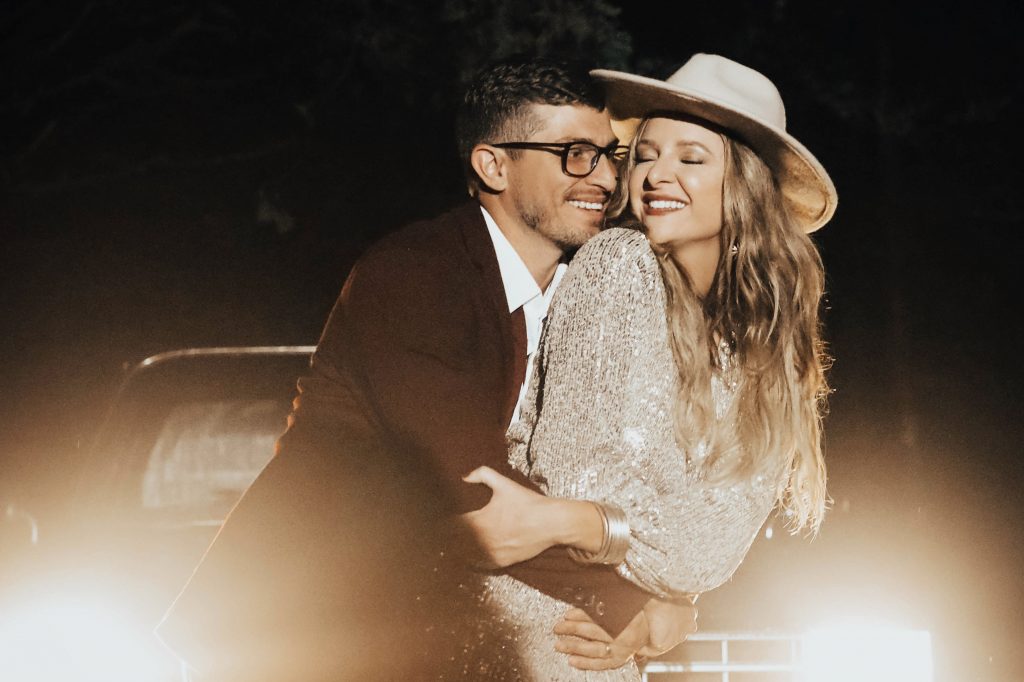 Bride and groom dance in front of her dad's 1985 Blue Chevy Truck.